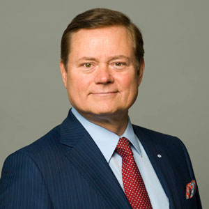 Blake Goldring, pictured in a blue suit and red tie. 
