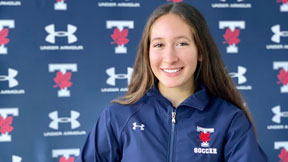 UofT Varsity athlete Hannah Chown smiling for the camera.