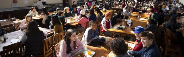 Students sitting in Burwash Dining Hall.