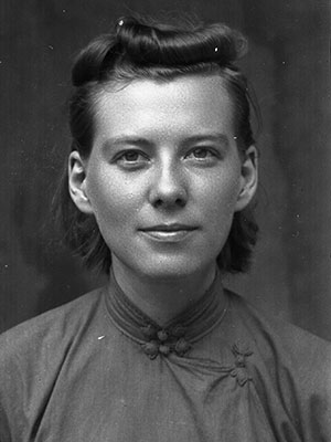 A grayscale photograph featuring a youthful Isabel Crook.