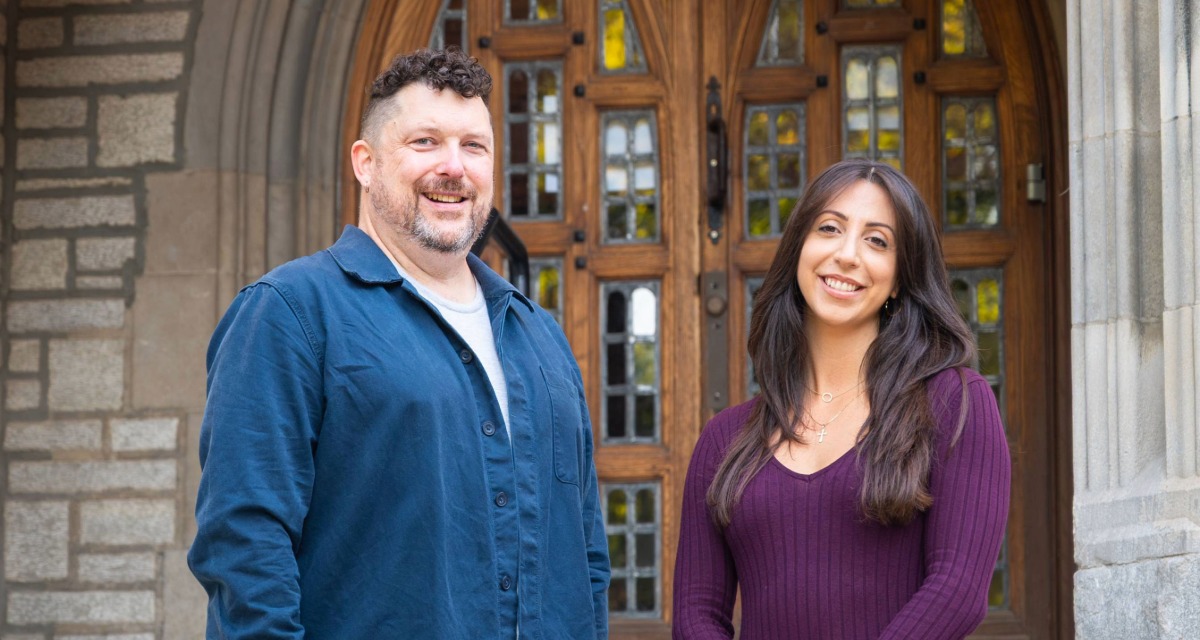 Blair Niblett (L) and Hannah Athanasiadis standing outside Emmanuel College.